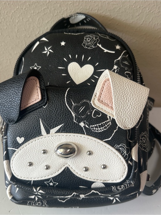 Betsey Johnson Handbags - Betsey Johnson Bulldog skull tattoo print mini back pack. Damage on the handle
